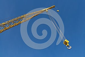 End of Yellow Crane against Blue Sky