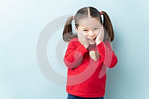 Endearing little girl in a studio