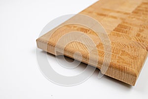 Endgrain wooden cutting board isolated above white background