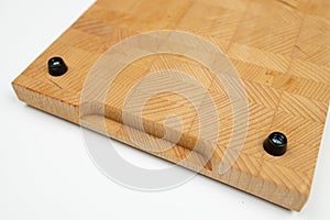 Endgrain wooden cutting board isolated above white background