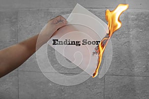 Ending soon text on burning paper