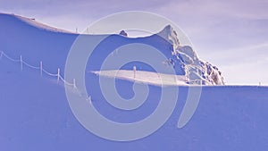 Endless blinding whiteness at sunny morning on the top of Kaprun glacier at Austrian Alps