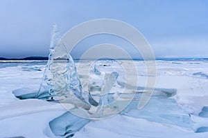 Endless blue ice hummocks in winter on the frozen Lake Baikal