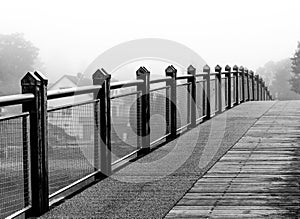 Endless bridge mist over lake-black and white