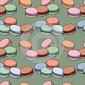 Endless pattern with assorted varicolored macaroons on mint background