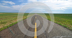 Endless road in the grassland