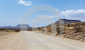 Endless road in Namibia moonscape landscape