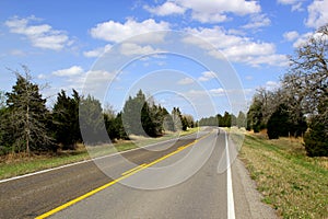 Endless road - Road leads through beautiful rural farm land - horizontal framed shot