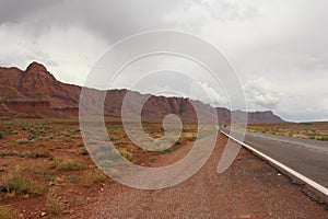 Endless road surrounded by great mountains, Nevada, photo