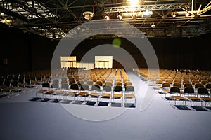 Endless rows of chairs in a modern conference hall