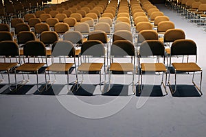 Endless rows of chairs in a modern conference hall