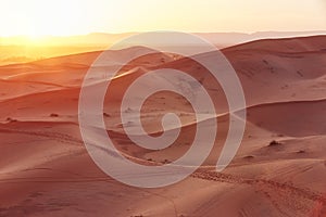 Endless Sands of the Sahara desert, the hot scorching sun shines on the sand dunes. Morocco Merzouga