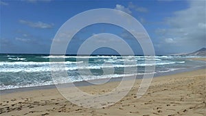 Endless sandy beach waves turquoise water.