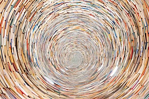 An endless spiraling tunnel of stacked books