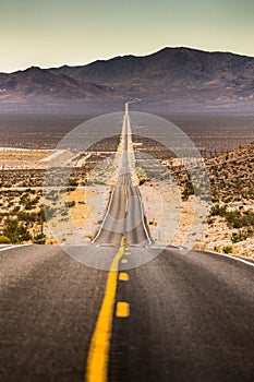 Endless straight road in Death Valley National Park, California, USA