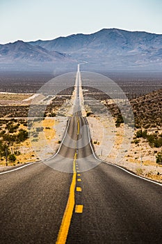 Endless straight road in Death Valley National Park, California, USA