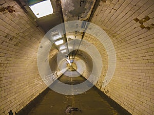 Endless tunnel  under the Tames river. Eternal walking underground.