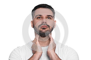 Endocrine system. Man doing thyroid self examination on white background