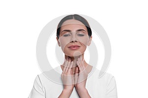 Endocrine system. Young woman doing thyroid self examination on white background