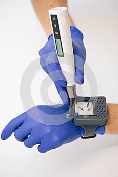 Endodontist physician places the endodontic instruments in a sterile box. A set of hand tools placed in a sterile box photo