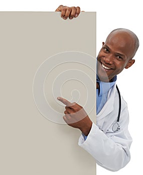 Endorsing your healthcare message. A young doctor pointing at an area reserved for copyspace. photo