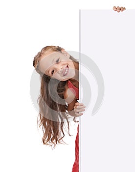 Endorsing your product. A little girl holding a blank placard for copyspace. photo