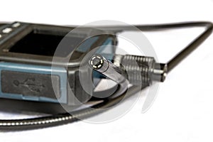 Endoscope camera on the table. Flexible inspection camera