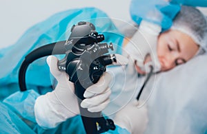 Endoscopy at the hospital. Doctor holding endoscope before gastroscopy