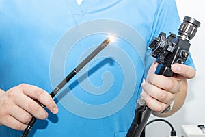 Endoscopy at the hospital. Doctor holding endoscope before gastroscopy. Medical examination