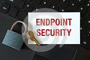 Endpoint Security - the inscription on the card and the lock on the background of the keyboard photo