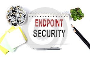 ENDPOINT SECURITY text on notebook with office supplies on white background
