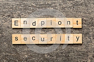 endpoint security word written on wood block. endpoint security text on table, concept