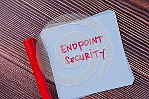 Endpoint Security write on sticky notes isolated on Wooden Table