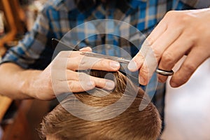 Ends of the hair being cut by a professional hairdresser