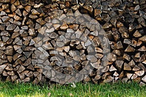 Ends of logs wooden background. toning. wood in the stack