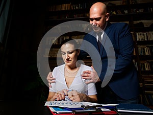 Enduring flirt. Shameless unpleasant bald boss touching his female worker while she suffering under his hands. Boss put hands on