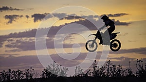 Enduro Bike jumping at sunset