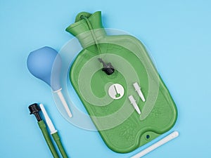 Enema, and accessories on blue background