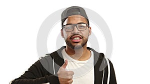 Energetic Afro-American Guy in Casual Attire Giving a Thumbs Up with a Nod