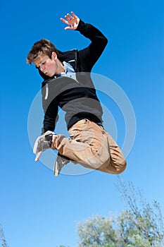 Energetic boy jumping.