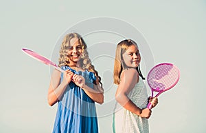 Energetic children. happy and cheerful. sporty game playing. summer outdoor games. play tennis. childhood happiness and