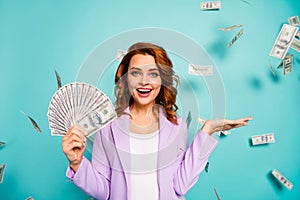 Energetic crazy woman hold hand money fan advertise lottery earnings dollars falling flying wear lilac formalwear suit