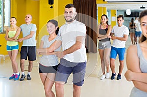 Energetic dancing couples learning salsa