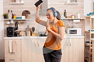 Energetic dancing in kitchen