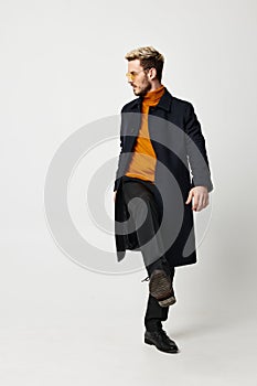 energetic man in orange sweater modern adult man suit coat pant