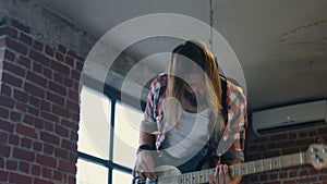 Energetic man playing bass guitar