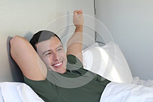 Energetic man waking up in the morning