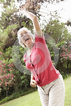 Energetic Senior Woman In Countryside