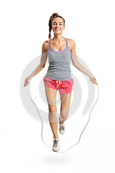 Energetic woman jumping rope