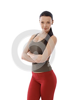 Energetic woman standing arms crossed
